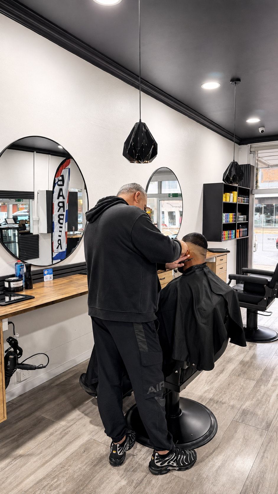 Barber at work at Barber Jacks, Gunnedah NSW
