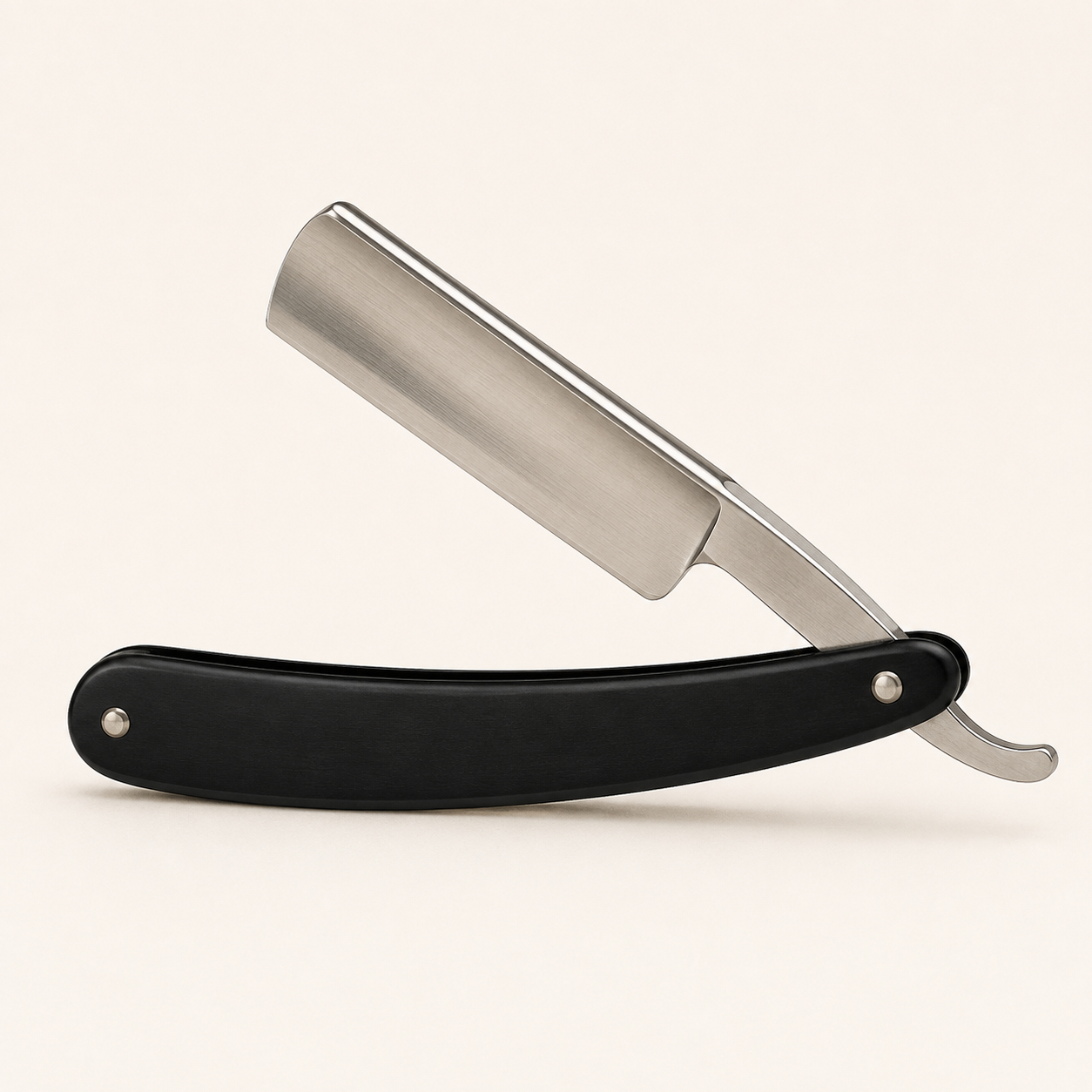Cutthroat razor with black handle and stainless steel blade holder