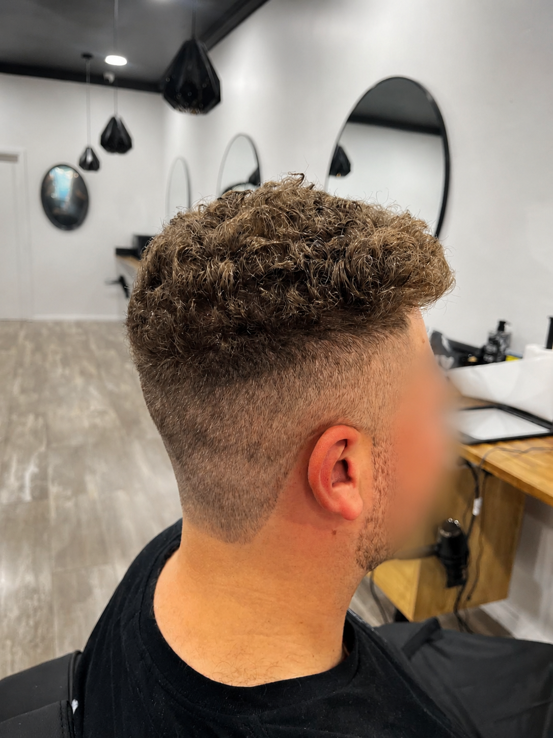 Completed skin fade with curly top at Barber Jacks, Gunnedah